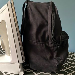 Mini Herschel backpack. Good Condition, no rips or tears, outer pocket